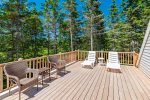 Walk Out the Primary Bedroom to Private Deck with Outdoor Furniture and Water Views